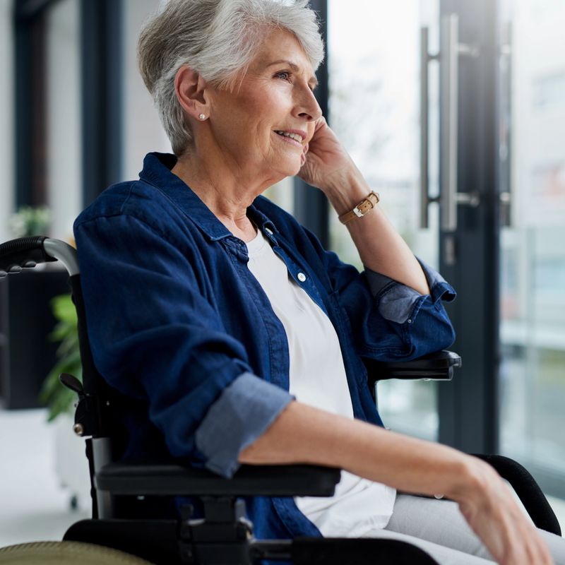 Cropped shot of a senior woman sitting at home in her wheelchair