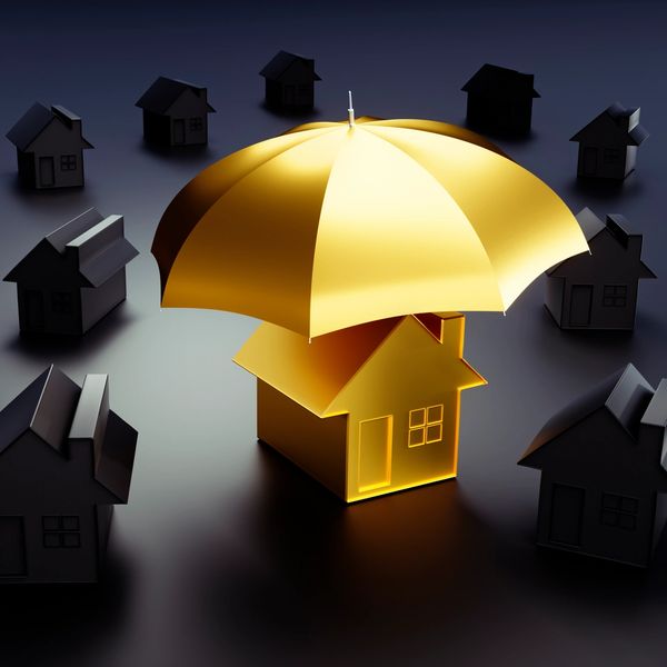 Golden house sheltered by a glowing umbrella among dark houses.