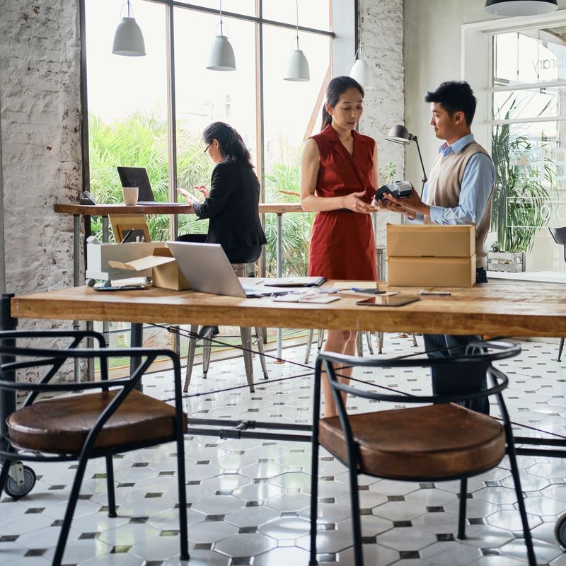 A small group of professionals at work within a co-working space fullfilling e-commerce orders in Taipei, Taiwan.
