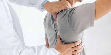 Patient receiving chiropractic adjustment in El Paso for neck and back pain caused by auto injuries.