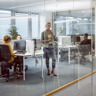 A person is writing on paper with a pen.