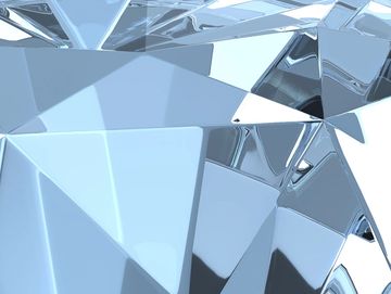 Close-up of a reflective, faceted crystal or diamond surface.