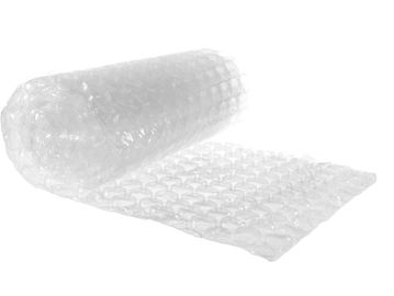 A roll of transparent bubble wrap partially unrolled on a white background.