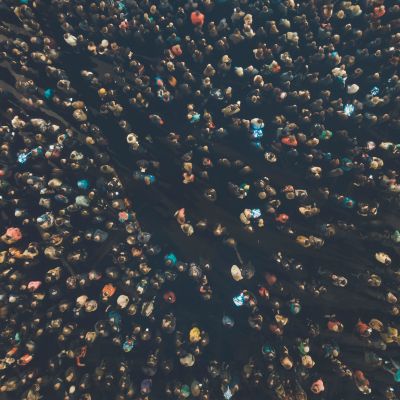 A dense crowd of people viewed from above.