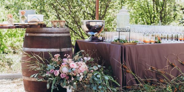 Whiskey barrel mobile bar setup at a wedding