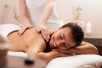 Woman enjoying a relaxing back massage.
