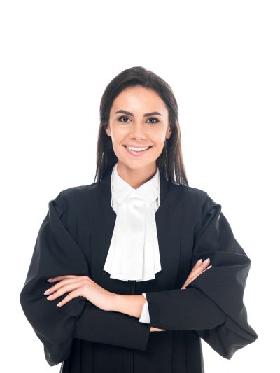 Young female lawyer smiling confidently, arms crossed.