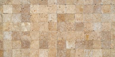 Honed and cleaned natural stone tiles with a sealed finish after professional stone restoration.