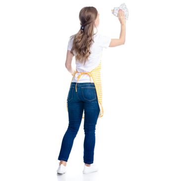 Woman cleaning a glass with a cloth, viewed from behind.
