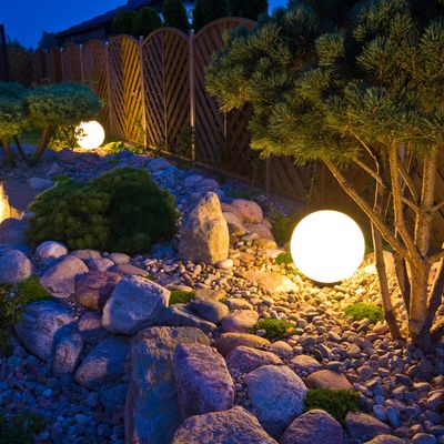 A nightscape, landscape lighting, a Japanese backyard, Japanese lanterns, outdoor lighti8ng design