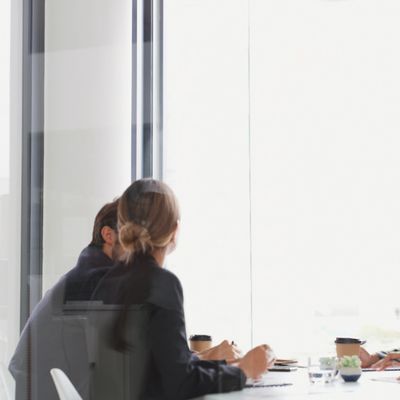 Two professionals having a business meeting in a modern office.