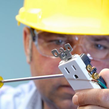 Electricians at work ensuring safety.