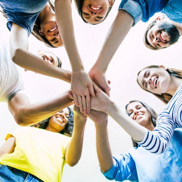 group members holding hands