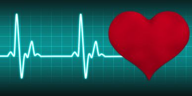 Bright heartbeat line with a large red heart on a grid background.