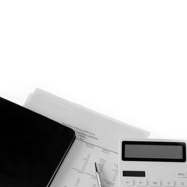Calculator, pen, notebook, and document on a white surface.