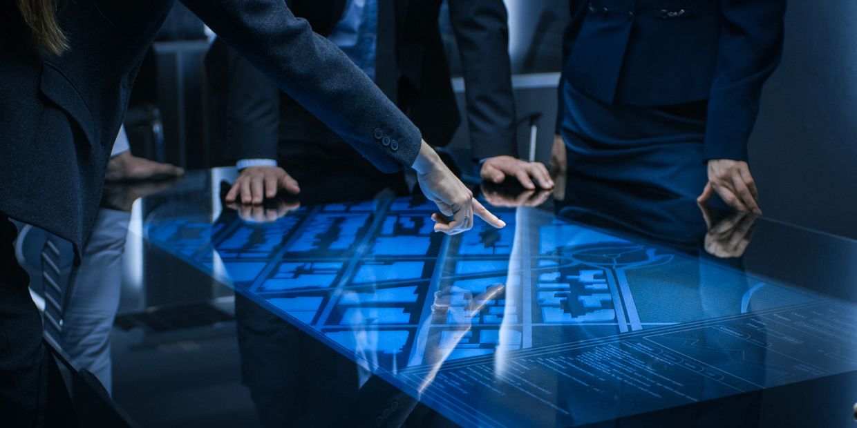 Private investigators in Jacksonville analyzing digital evidence on high-tech screen