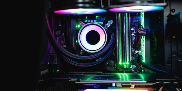 RGB-lit gaming PC interior showcasing cooling fans and components.