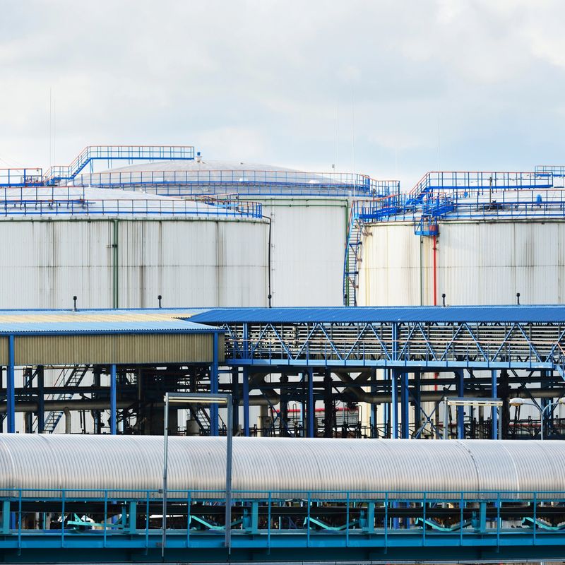 Oil storage tanks at Ventspils terminal on a clear summer day, Latvia