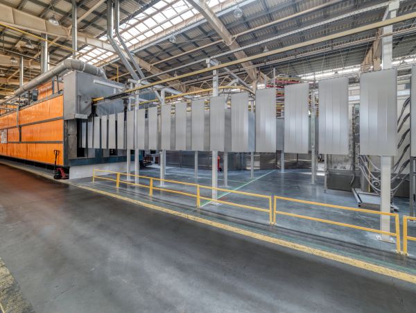 Industrial metal panels hanging in a factory.