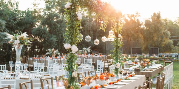 Elegant floral centerpiece on a decorated wedding table.