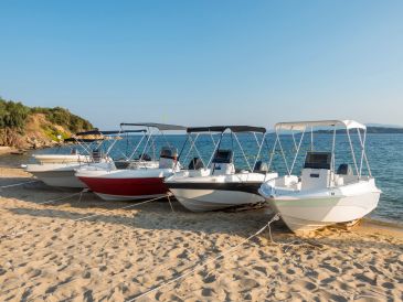 Boats resting on sand bard