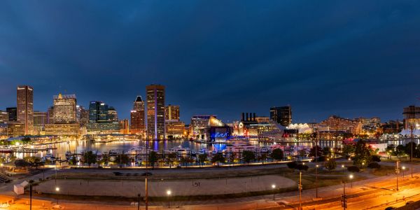 Baltimore neighborhood with Wi-Fi signals symbolizing connectivity.