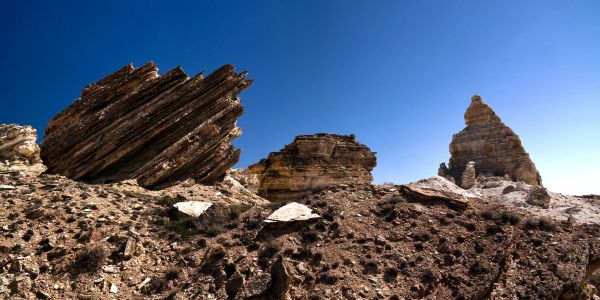 Rock formations under a clear blue sky.