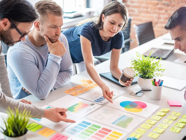 A group of people looking at a plan