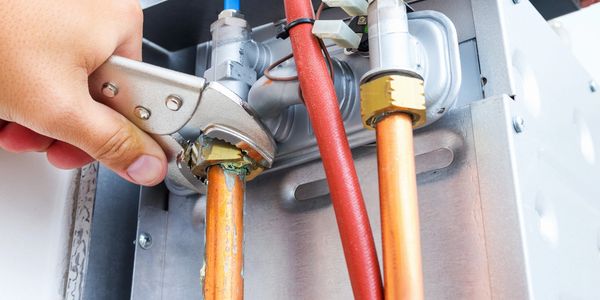 A water pipe in a restroom trailer.
