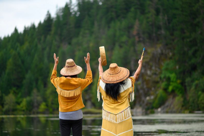 Native American Women performing a welcome song. First Nations women singing. Traditional Canadian culture.