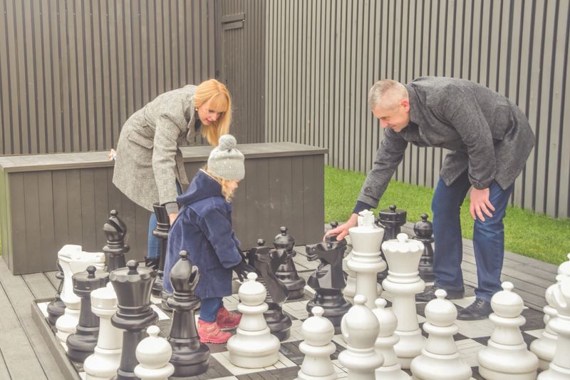 the family baby dad mom Playground play autumn outside chess