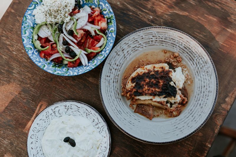 Series of authentic and traditional Greek food - Greek salad, tzatziki, Kleftiko, Moussaka, Souvlaki, Pita.