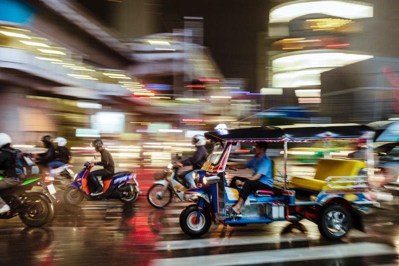 City street traffic at night in Bangkok, Thailand