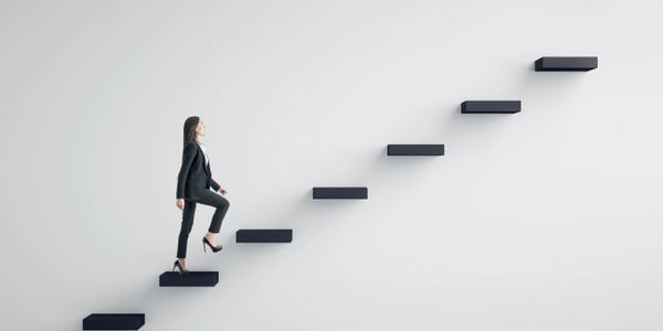 Businesswoman climbing floating stairs symbolizing career growth.