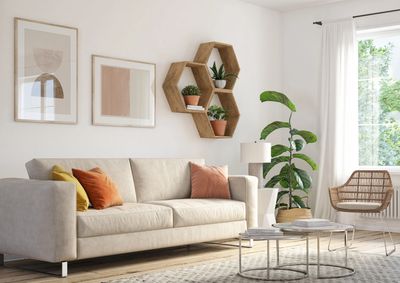 Bright living room with beige sofa, colorful cushions, and natural wood accents.