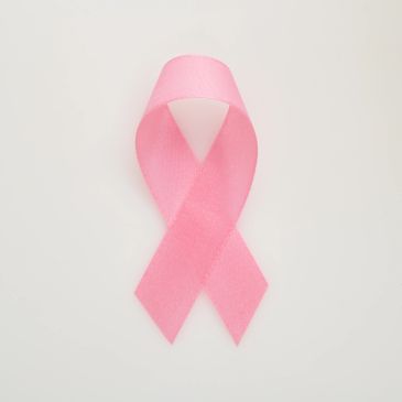 Pink ribbon on a white background.