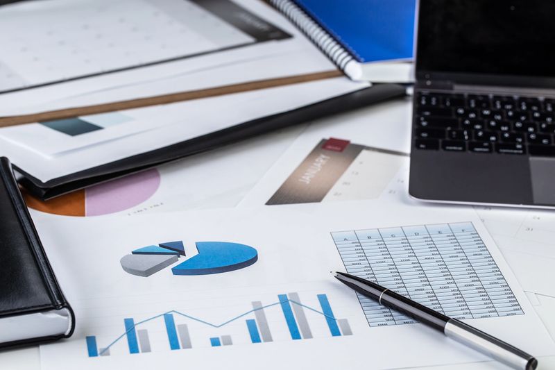 Sales, report, laptop, pen, diagram