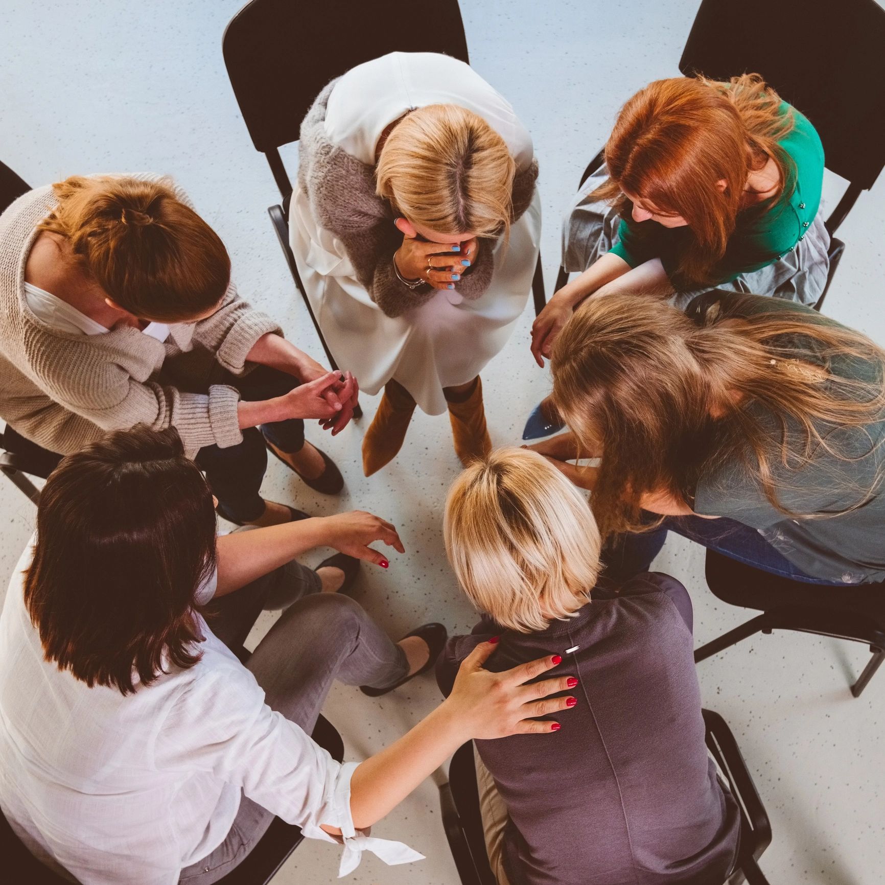 Group therapy session with emotional support.