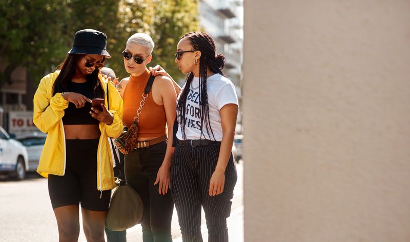 Shot of three close friends spending the day together in the city