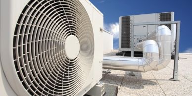 Outdoor HVAC unit with ventilation ducts.