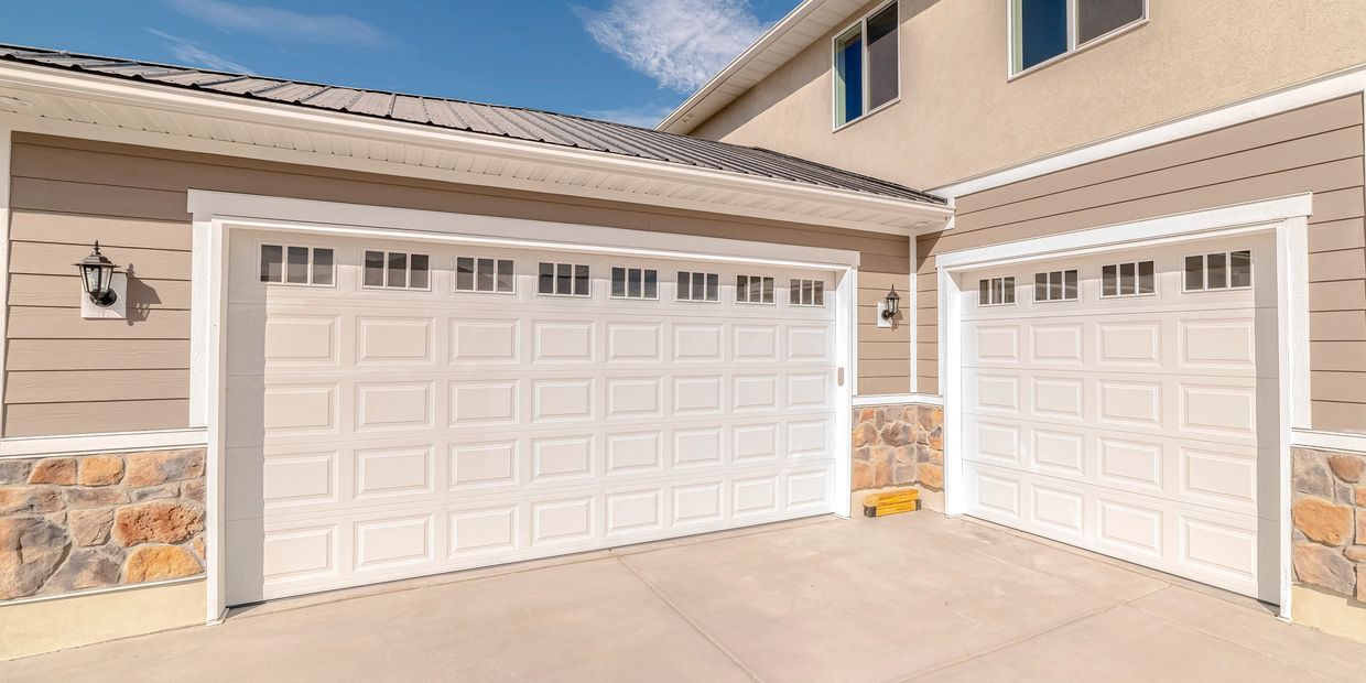 The doors featured in this photo are the standard design, short, raised panel with madison inserts.