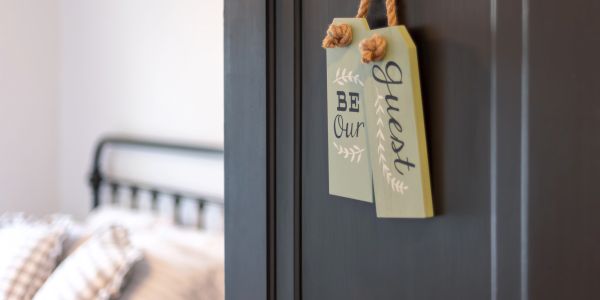 Guest room door sign hanging on door.