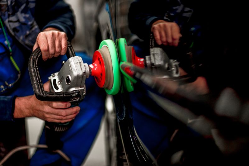 Polishing a car segment using an electric orbital polisher.
