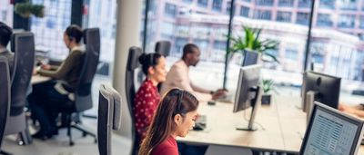 People working on computers in an office.