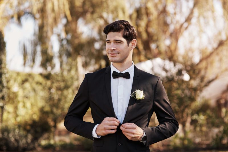 Cropped shot of a handsome young bridegroom looking thoughtful while adjusting his suit on his wedding day