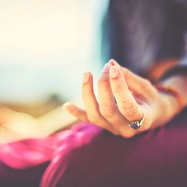 hand in a mudra gesture