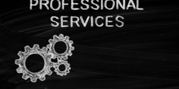 Chalkboard with the words 'Professional Services' and gears illustration.