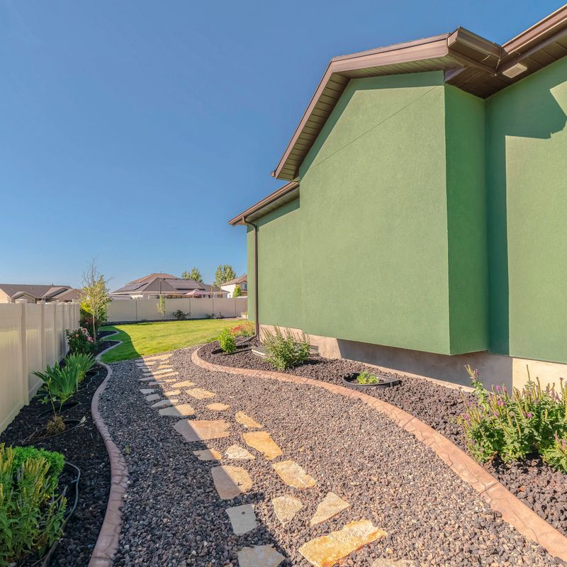 Square Landscaped garden pathway and suburban backyard day. Landscaped garden pathways in suburban backyard on a sunny, clear day.