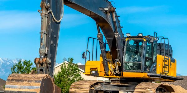 excavator digging pipe 