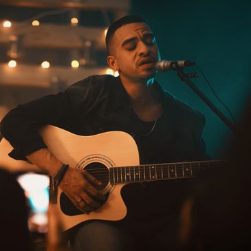 Guitarist performing at an intimate listening room in Atlanta